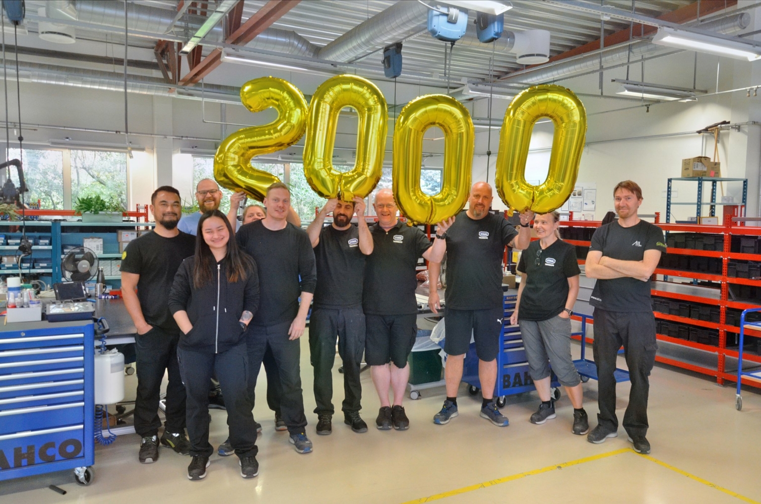 Employees in the production team at R. STAHL Tranberg celebrating 2000 followers on LinkedIn