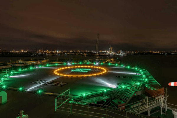 Offshore helideck for helicopter landing at night. All Circle & H lights turned on.