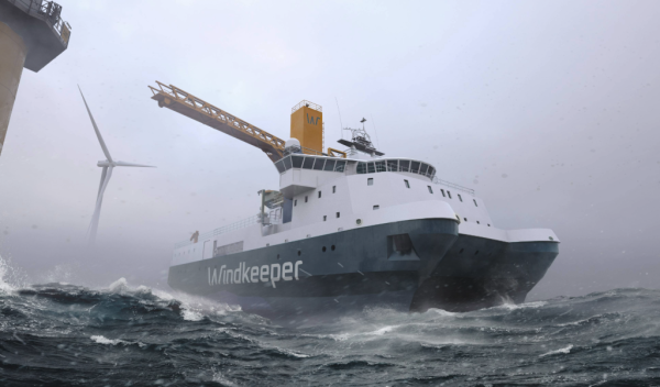 Marine vessel in heavy sea with offshore windmill in the background.